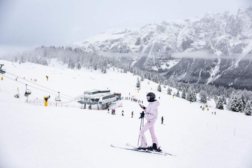 a person on skis on a snowy slope